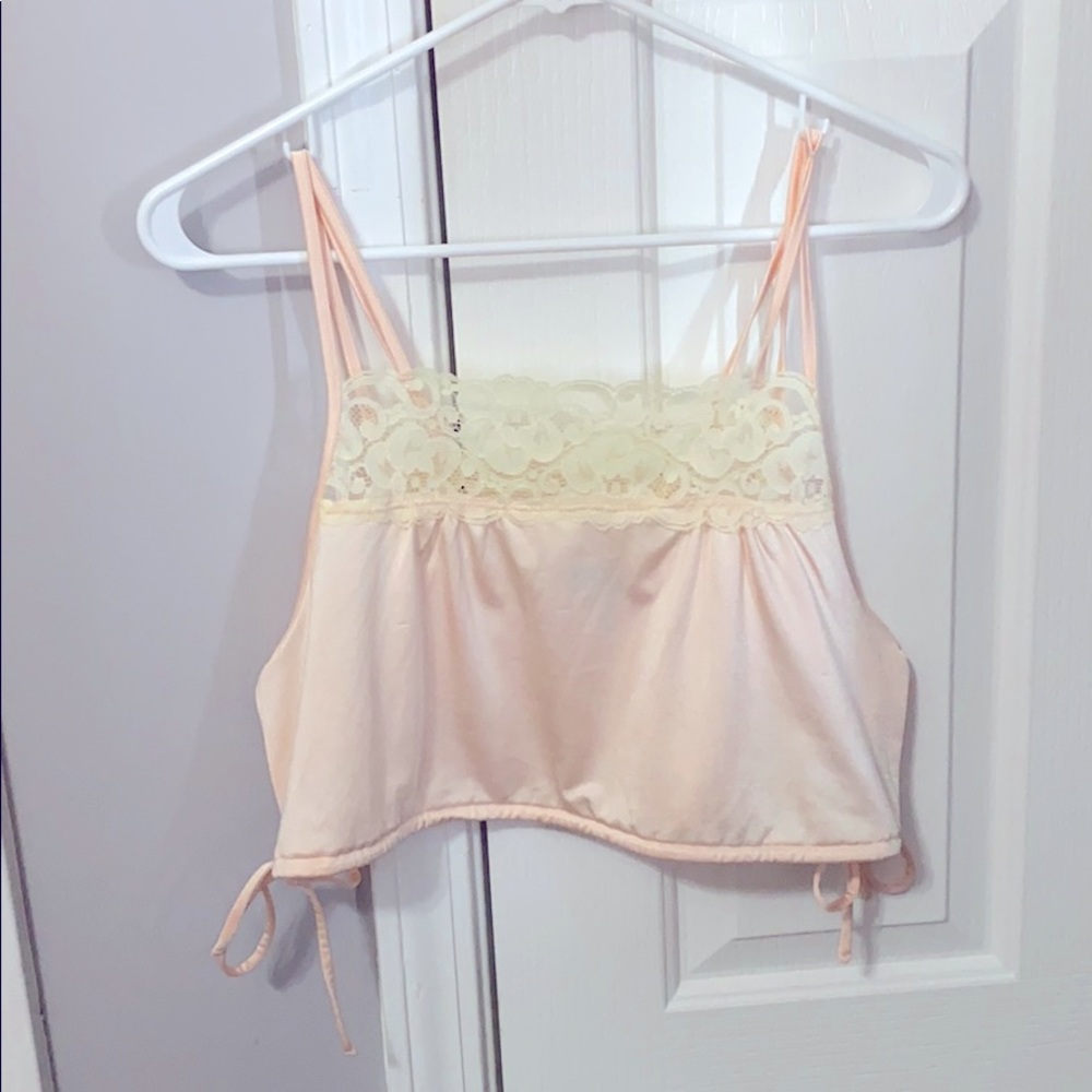 Light pink silky tank top.